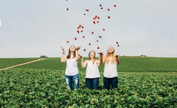 Sisters Throwing Strawberries Field_shopped